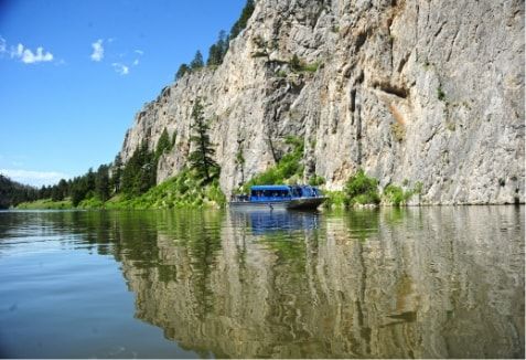 A boat on a lake at Gates of the Mountains.