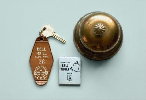 A room key, match box and bell.